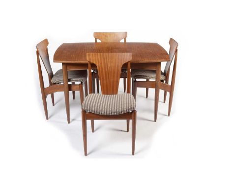 Elliott's of Newbury: A mid-Century teak extendable dining table and chairs, the table opening to reveal an extra leaf within