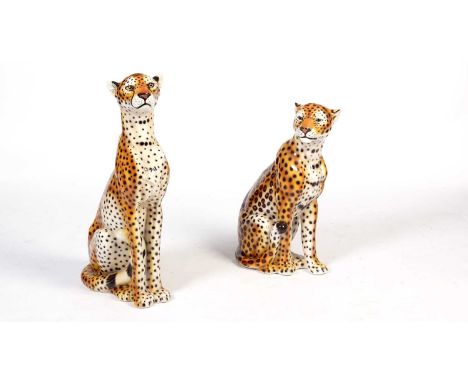 A late 20th Century Italian slip cast pottery model of a seated cheetah, coloured and glazed, 85cms; and another similar smal