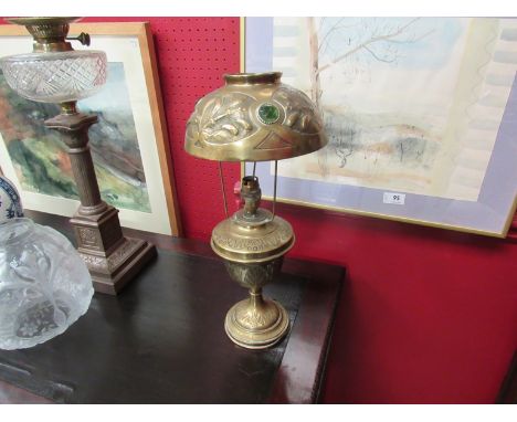 A Victorian brass oil lamp and shade with glass cabochons, 45cm tall