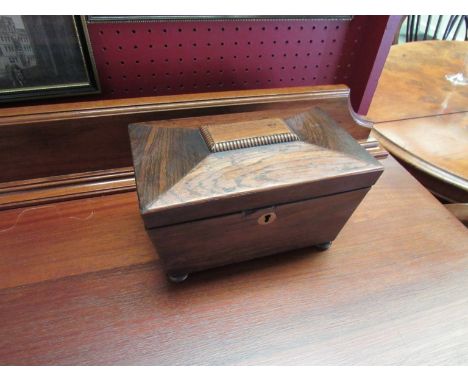 A Victorian rosewood tea caddy on squashed bun feet
