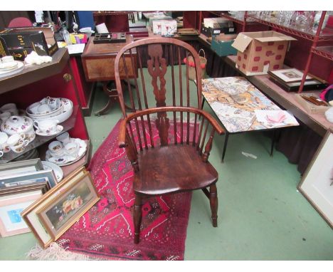 Stamped "H.S" circa 1860 an elm and oak stick back Windsor elbow chair the hoop back with fret central splat over ring turned