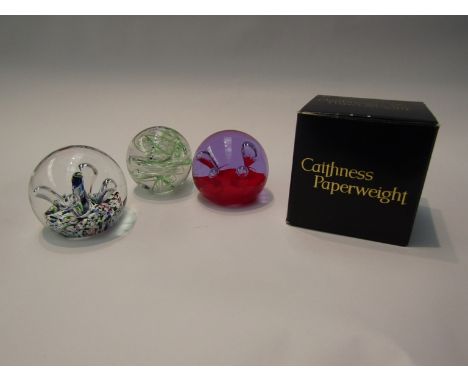 Three art glass paperweights including Caithness and Langham