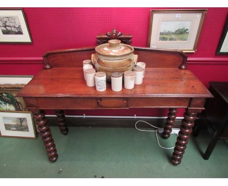 A late Victorian oak serving table the raised back over two frieze drawers on bobbin turned legs, 138cm x 48cm x 119cm