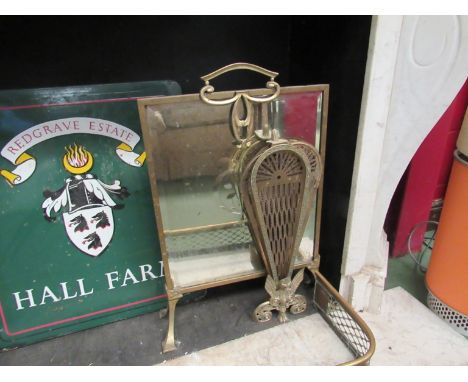 A brass fan firescreen a/f and an Art Nouveau brass firescreen with mirror panel (2)  