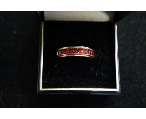 9ct Gold ring set with 10 rubies 