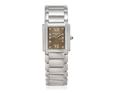 PATEK PHILIPPE TWENTY-4 REF. 4910/10A, BOX AND GUARANTEE, SOLD IN 2000 - Case: signed, n. 4121797, stainless steel, sides set