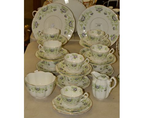 An Edwardian tea service, comprising a pair of sandwich plates, milk jug, sugar bowl, teacups, saucers and sideplates 