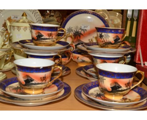 A  Czechoslovakian tea service, for six  each printed with Bedouin encampment, in the Noritake manner