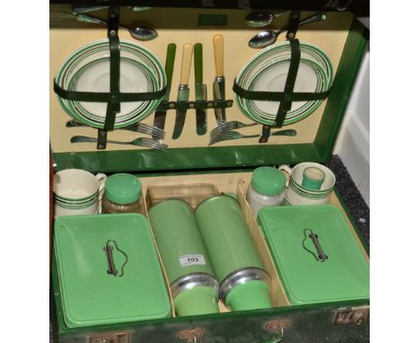 A "Sirram" picnic hamper in green, complete with two flasks two tins, etc