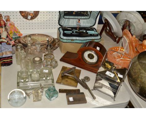 An Edwardian mahogany mantel barometer;  a chrome mounted biscuit barrel;  a musical manicure set;  a Dallmeyer calculator;  