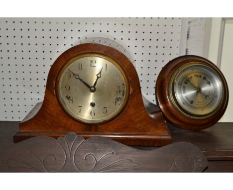 A 1930s mahogany Napoleon mantel clock, the silvered circular dial with Arabic numerals, eight day movement striking on a bel