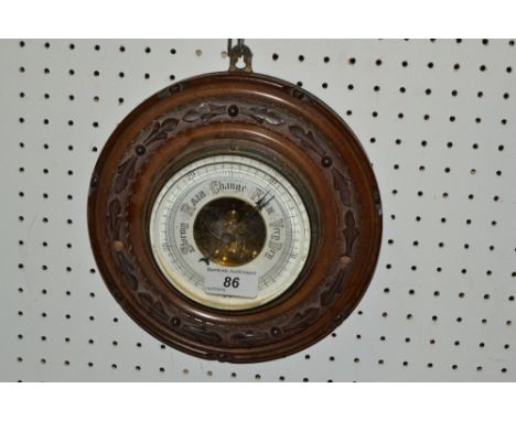 A mahogany circular aneroid barometer
