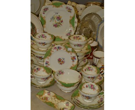 A Paragon Rockingham pattern part tea service, comprising three teacups, four large cups, side plates, bread and butter plate