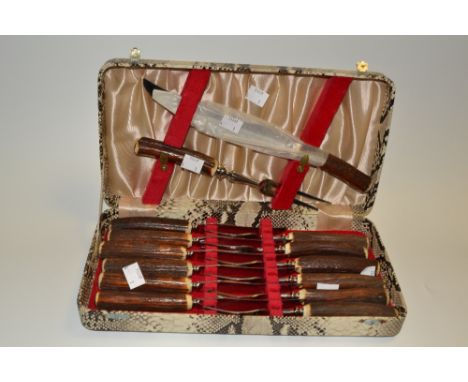 A 20th century antler-hafted canteen, comprising carving knife and fork, knives and forks, cased 