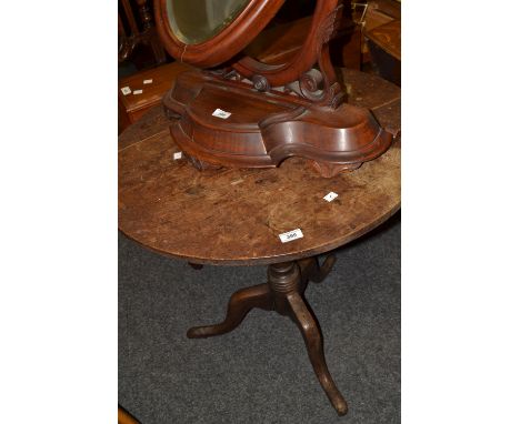 A George III oak circular tilt top table, tripod base, pad feet, c.1800