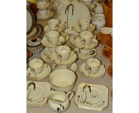 A Royal Doulton Art Deco tea service, for twelve, comprising teacups, saucers, side plates, six square tea plates, two bread 