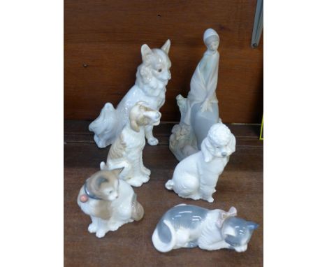 Six Nao figures, three dogs, two cats and a lady with piglets