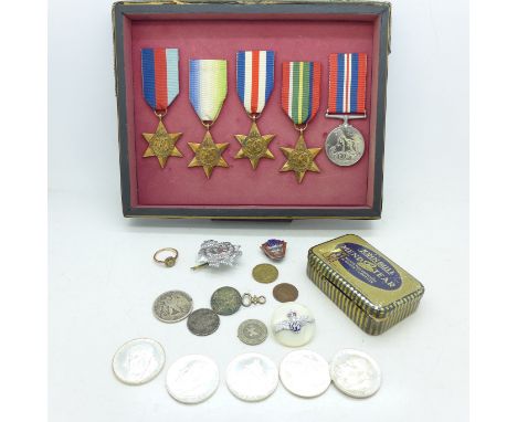 A group of five WWII medals, (glued to the backing), a RAF brooch, a silver and enamel NUR badge, etc.