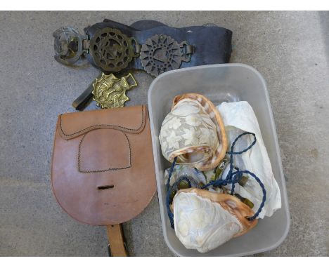 A pair of carved shell wall lights and horse brasses and a WWII messenger pouch marked D.M.&amp;S Ltd., 1944 with broad arrow