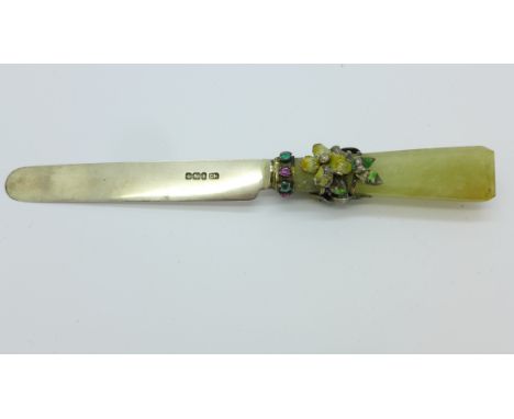 A jade handled and silver butter knife, set with rubies and emeralds, some enamel a/f