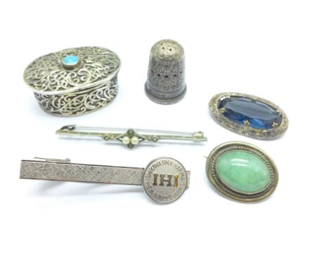 A white metal pill box, a silver thimble, a/f, brooches and a tie pin with Chinese marks