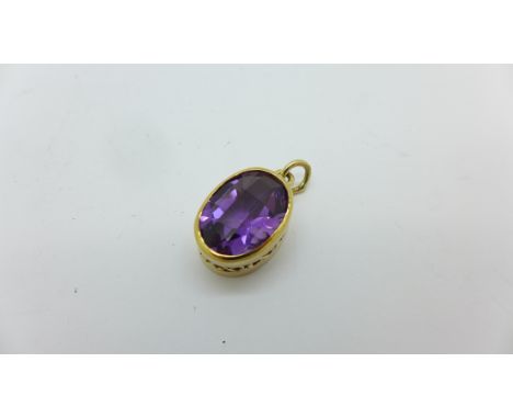 A yellow metal set amethyst pendant, stone 17mm x 13mm