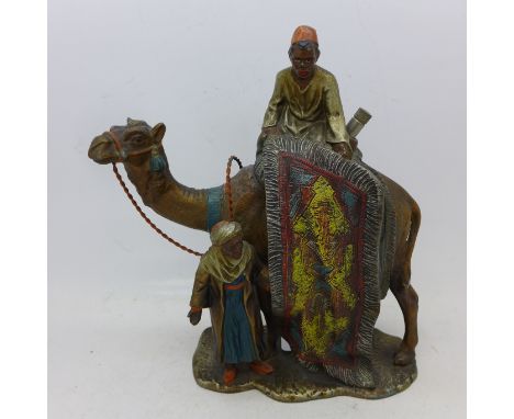 A cold painted table lighter, The Carpet Seller