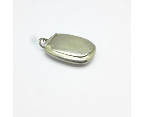 A silver miniature compact, no mirror