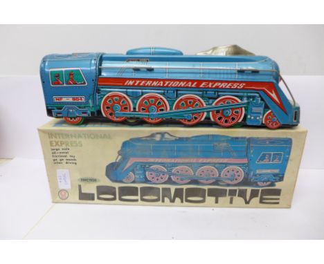 An International Express large scale friction locomotive, boxed, made in China