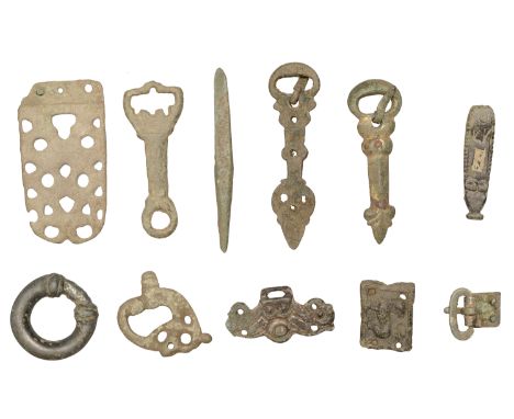 Saxon-Medieval bronze artefacts (9), includes gilt wrist clasp, moulded with a face mask; D-shaped buckle; 9th century strap 