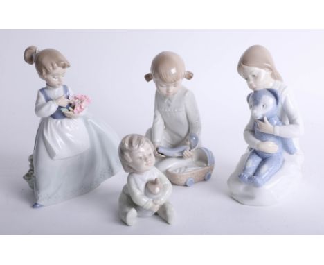 A collection of four Nao figures including 'Girl with flowers'.