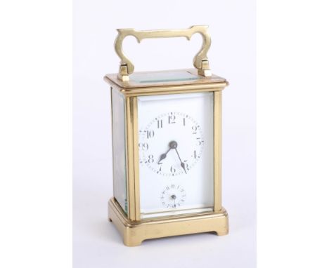 A French carriage clock with alarm, with Roman numerals, two dials, height 15cm, handle up.