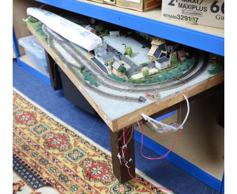 A large collection of N-Gage model railway including locomotives, wagons, buildings, some Hornby, track layouts etc.