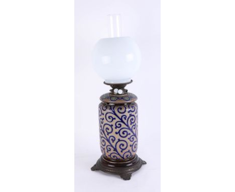 Royal Doulton, an art pottery oil lamp, damaged, with opaline shade, height including shade 52cm.