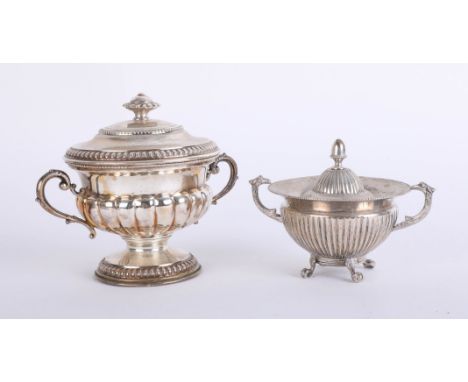 A continental silver handled cup and cover marked 800, together with a smaller similar model (2) approximately 17.34oz.
