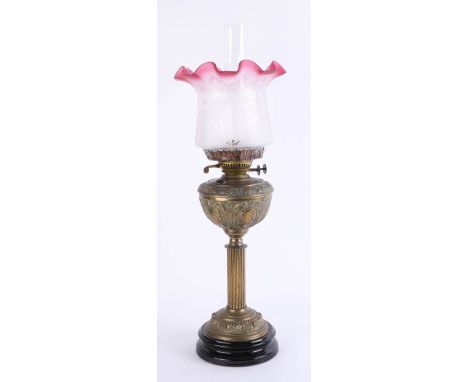 An oil lamp, height 65cm.