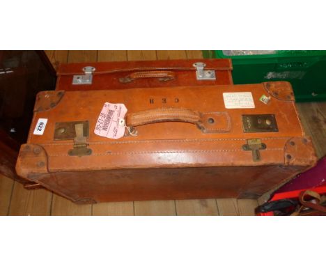 Two vintage leather suitcases
