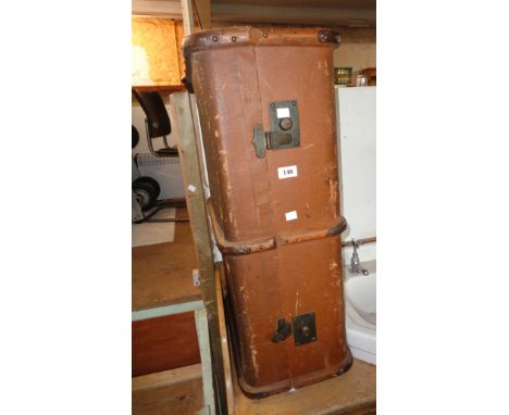 A vintage metal and bentwood bound travelling trunk with tray fitted interior and canvas weather coating