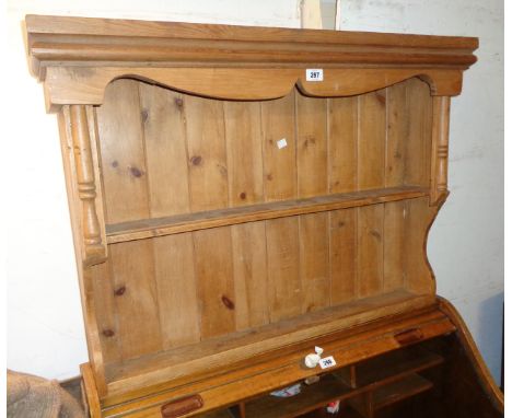 A 3' 1" 20th Century waxed pine wall mounted two shelf open plate rack with moulded decoration