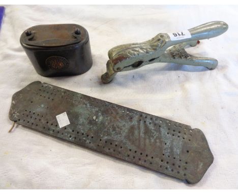 A cast iron Baird &amp; Tatlock of London cork press, Birmingham Municipal money bank and a brass cribbage board