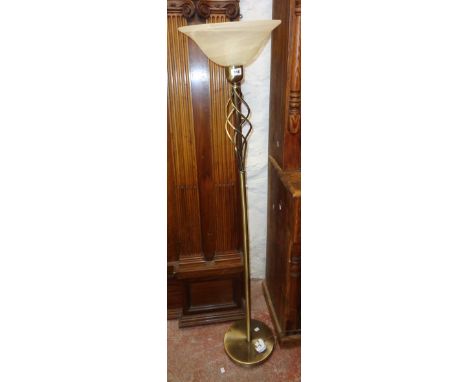 A modern uplighter lamp standard with brushed metal finish and smoked glass shade