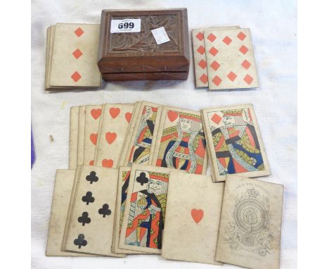 A set of early 19th Century wood block printed single-ended playing cards by Reynolds &amp; Sons - sold with a Swiss carved w