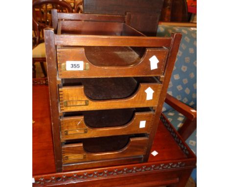 A 12 1/2" vintage stained wood table-top filing unit with four drawers