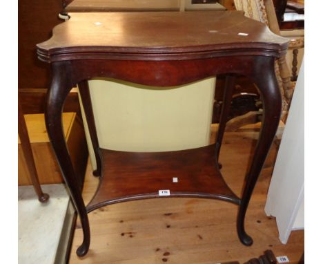 A 24" Edwardian stained mahogany swivel top card table with serpentine edge and shaped undertier, set on cabriole supports wi