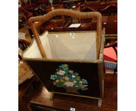 A 19 1/2" vintage ebonised and parcel gilt board magazine browser with Barbola style floral decoration to front, cane bound h