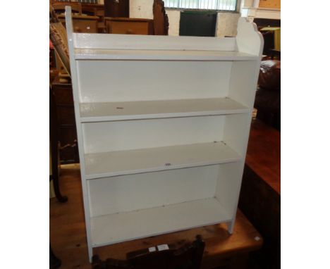 A 25" early 20th Century painted wood free-standing four shelf open bookcase