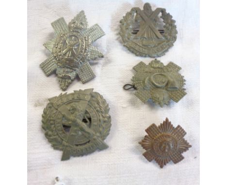 Five Scottish army cap badges comprising Highland Light Infantry, Scots Guards, Cameron Highlanders, London Scottish, and Bla