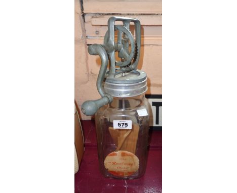 A vintage Rowlway table butter churn