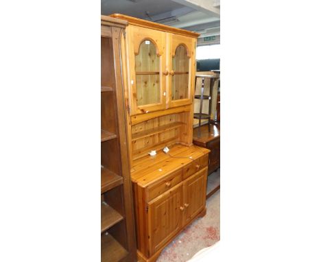 A 3' 1" modern Regent Pine two part dresser with illuminated and part glazed top section over a base with two short drawers a