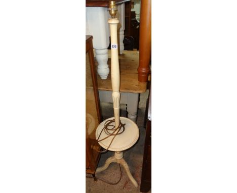 A low painted wood standard lamp/wine table, set on turned pillar and tripod base